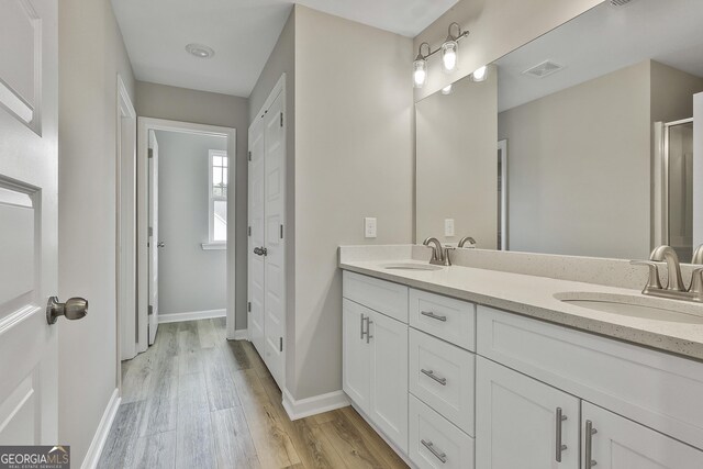 51 Camden Cir, Newnan, GA 30265 - full bathroom with a sink, baseboards, and wood finished floors