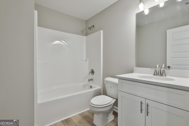 51 Camden Cir, Newnan, GA 30265 - full bath featuring visible vents, wood finished floors, vanity, toilet, and  shower combination