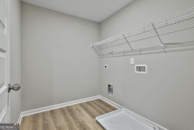 51 Camden Cir, Newnan, GA 30265 - laundry room with laundry area, wood finished floors, baseboards, electric dryer hookup, and washer hookup