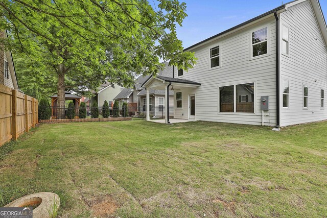 51 Camden Cir, Newnan, GA 30265 - back of property featuring a lawn, a patio, a gazebo, and a fenced backyard