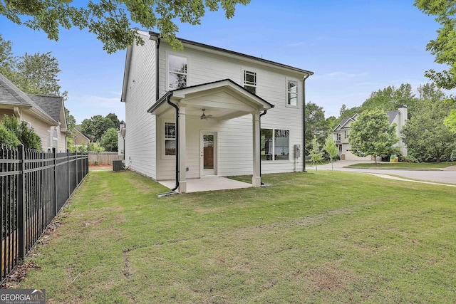 51 Camden Cir, Newnan, GA 30265 - back of property featuring ceiling fan, fence, a patio, a lawn, and central air condition unit
