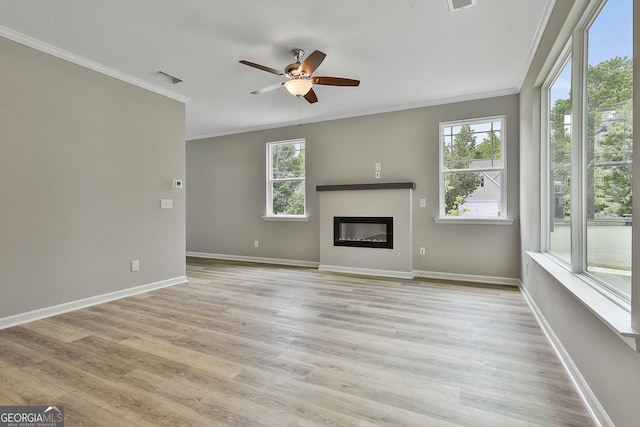 51 Camden Cir, Newnan, GA 30265 - unfurnished living room featuring ceiling fan, ornamental molding, and light wood finished floors