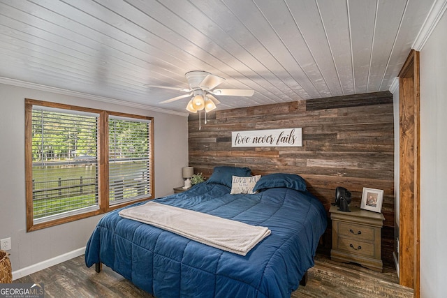370 David Williams, Sparta, GA 31087 - bedroom featuring a ceiling fan, crown molding, wood walls, wood finished floors, and baseboards