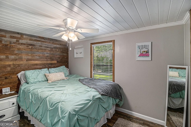 370 David Williams, Sparta, GA 31087 - bedroom with ornamental molding, wood walls, ceiling fan, and dark wood-type flooring