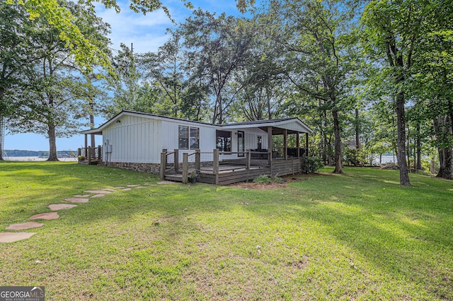370 David Williams, Sparta, GA 31087 - exterior space featuring a front lawn, board and batten siding, and a wooden deck