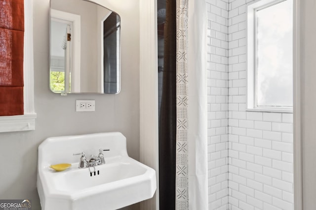26 Clarendon Ave, Avondale Estates, GA 30002 - bathroom featuring a sink and a tile shower