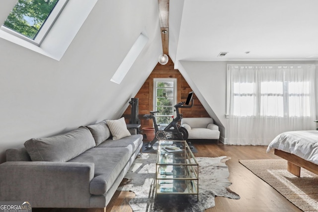 26 Clarendon Ave, Avondale Estates, GA 30002 - living room with visible vents, wood finished floors, and vaulted ceiling with skylight