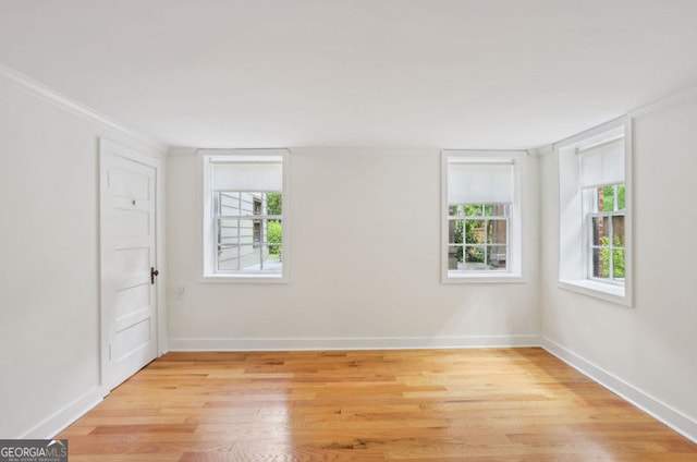 26 Clarendon Ave, Avondale Estates, GA 30002 - spare room featuring baseboards, plenty of natural light, and light wood-type flooring