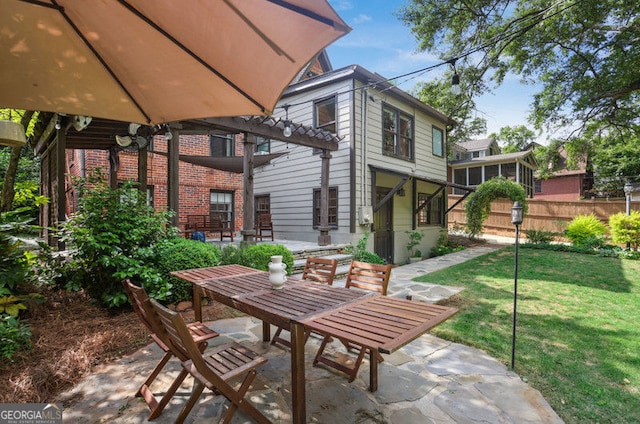 26 Clarendon Ave, Avondale Estates, GA 30002 - view of patio with outdoor dining area and fence