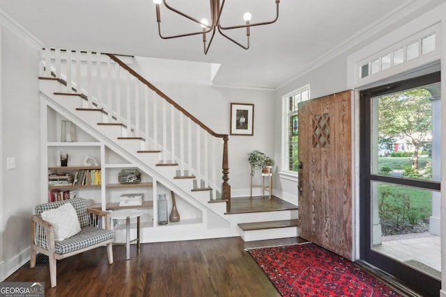 26 Clarendon Ave, Avondale Estates, GA 30002 - foyer featuring crown molding, an inviting chandelier, wood finished floors, baseboards, and stairway