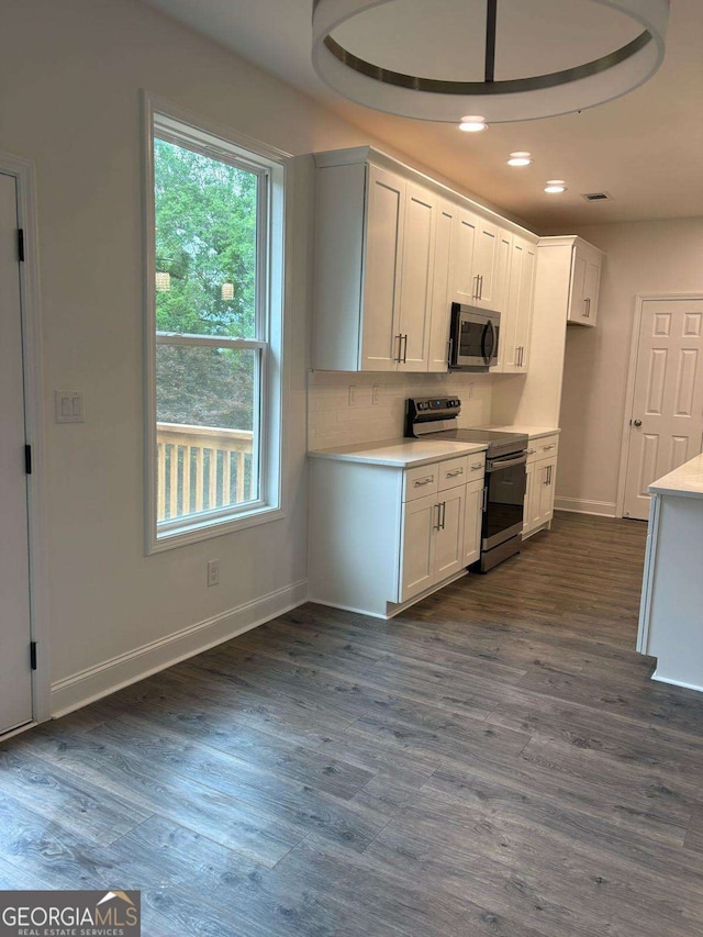 569 Tinker Bell Cir, Flintstone, GA 30725 - kitchen featuring light countertops, appliances with stainless steel finishes, baseboards, and white cabinetry