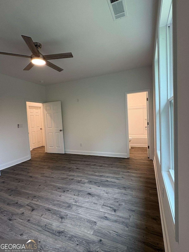 569 Tinker Bell Cir, Flintstone, GA 30725 - unfurnished room featuring a ceiling fan, baseboards, visible vents, and dark wood finished floors
