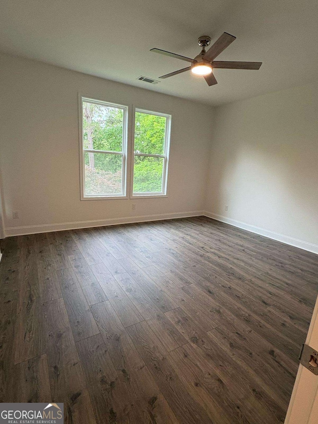 569 Tinker Bell Cir, Flintstone, GA 30725 - unfurnished room with a ceiling fan, baseboards, visible vents, and dark wood-type flooring