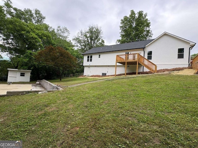 569 Tinker Bell Cir, Flintstone, GA 30725 - rear view of property with an outbuilding, a wooden deck, a yard, and stairway