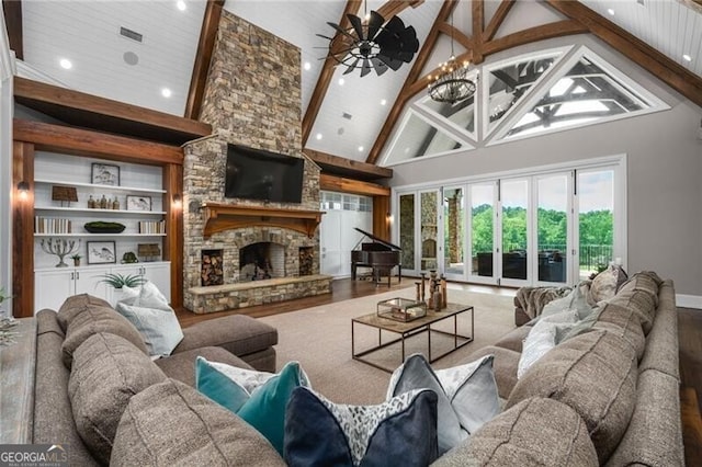 1101 N Flat Rock Rd, Douglasville, GA 30134 - living room featuring ceiling fan, high vaulted ceiling, a stone fireplace, recessed lighting, and wood finished floors