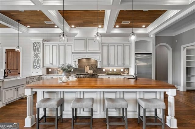 1101 N Flat Rock Rd, Douglasville, GA 30134 - kitchen with butcher block counters, built in fridge, tasteful backsplash, a sink, and coffered ceiling