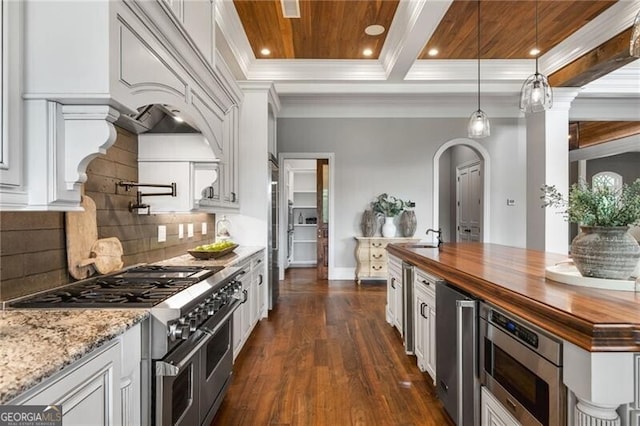 1101 N Flat Rock Rd, Douglasville, GA 30134 - kitchen featuring dark wood-style flooring, white cabinets, butcher block counters, ornamental molding, and stainless steel appliances