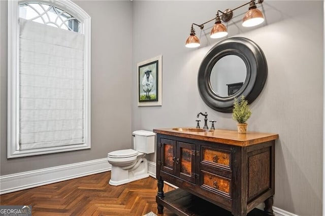1101 N Flat Rock Rd, Douglasville, GA 30134 - bathroom with baseboards, toilet, and vanity