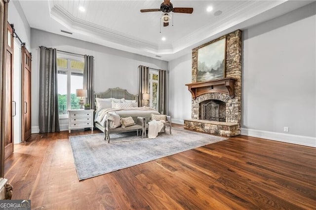 1101 N Flat Rock Rd, Douglasville, GA 30134 - bedroom with crown molding, a tray ceiling, and wood finished floors