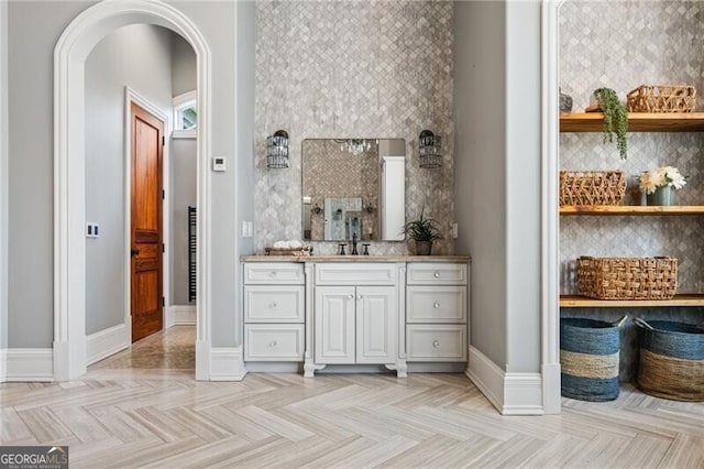 1101 N Flat Rock Rd, Douglasville, GA 30134 - bathroom featuring vanity, baseboards, and decorative backsplash