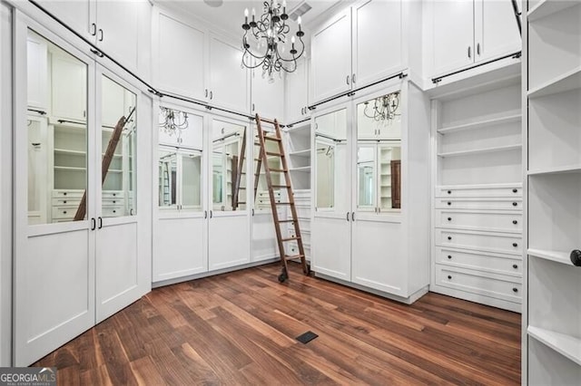 1101 N Flat Rock Rd, Douglasville, GA 30134 - spacious closet with an inviting chandelier and dark wood finished floors