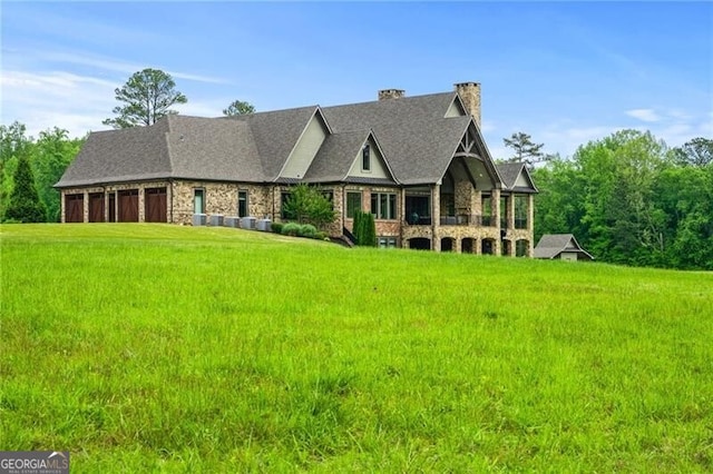 1101 N Flat Rock Rd, Douglasville, GA 30134 - view of front of property with a chimney, a front lawn, stone siding, and a garage