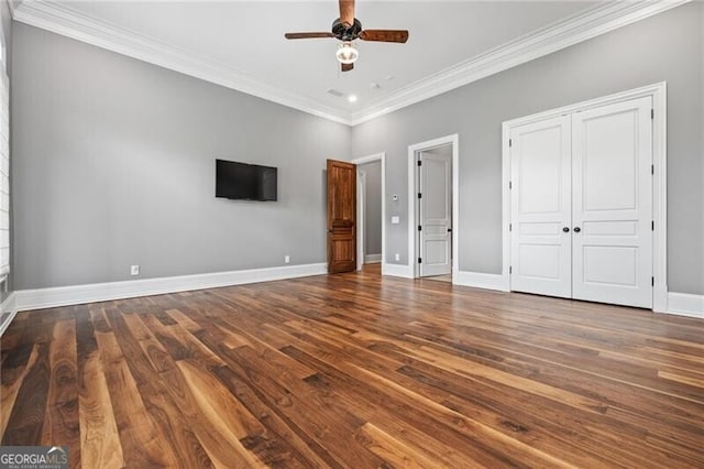 1101 N Flat Rock Rd, Douglasville, GA 30134 - unfurnished bedroom with crown molding, a ceiling fan, baseboards, wood finished floors, and a closet