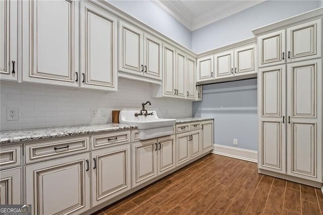 1101 N Flat Rock Rd, Douglasville, GA 30134 - kitchen with a sink, cream cabinets, ornamental molding, and backsplash