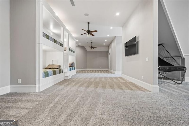 1101 N Flat Rock Rd, Douglasville, GA 30134 - unfurnished living room with baseboards, a ceiling fan, recessed lighting, and light colored carpet