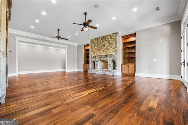 1101 N Flat Rock Rd, Douglasville, GA 30134 - unfurnished living room featuring ceiling fan, visible vents, built in features, a fireplace, and baseboards