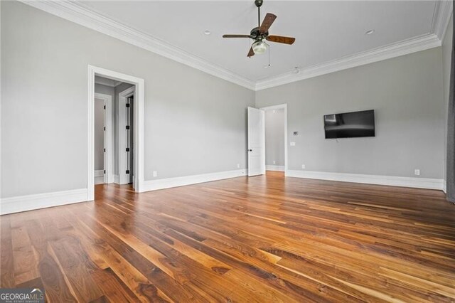 1101 N Flat Rock Rd, Douglasville, GA 30134 - unfurnished living room with baseboards, ornamental molding, a ceiling fan, and wood finished floors