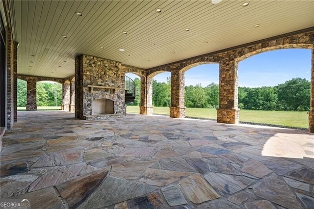 1101 N Flat Rock Rd, Douglasville, GA 30134 - view of patio / terrace with an outdoor stone fireplace