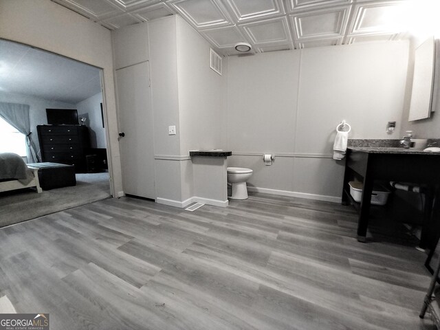 328 Kelly Creek Rd, Waco, GA 30182 - bathroom featuring toilet, an ornate ceiling, wood finished floors, baseboards, and vanity