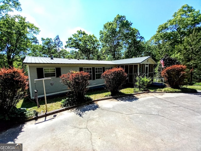 328 Kelly Creek Rd, Waco, GA 30182 - view of front of property with a sunroom and metal roof