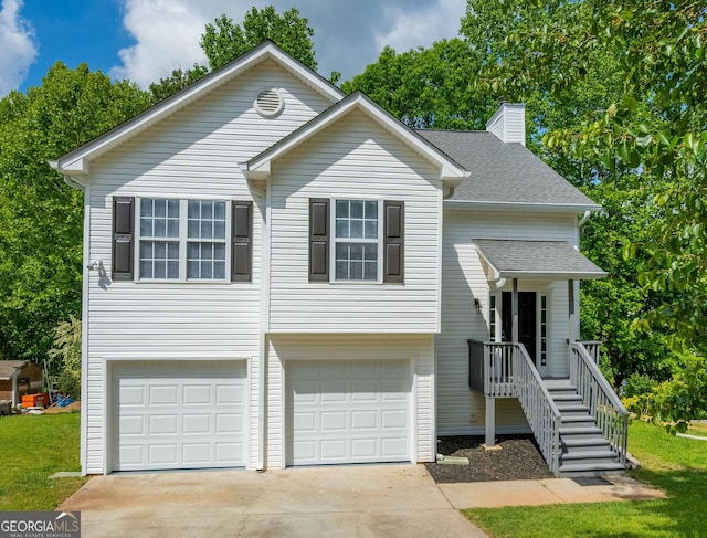 5135 Gable Ridge Way, Sugar Hill, GA 30518 - view of front of house featuring an attached garage, roof with shingles, driveway, and a chimney