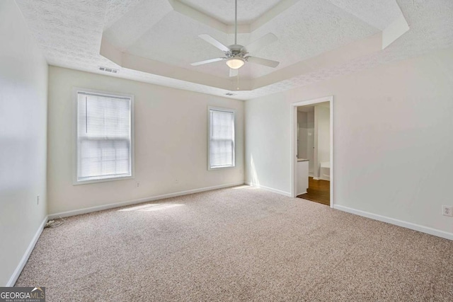 5135 Gable Ridge Way, Sugar Hill, GA 30518 - unfurnished room featuring a raised ceiling, a ceiling fan, a textured ceiling, and carpet