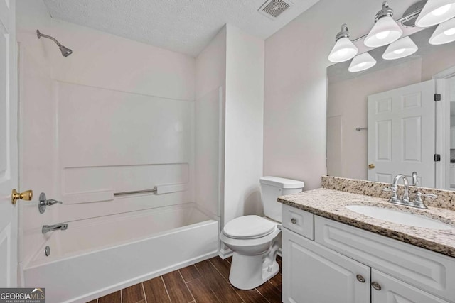 5135 Gable Ridge Way, Sugar Hill, GA 30518 - full bathroom featuring shower / bath combination, visible vents, wood finished floors, vanity, and toilet