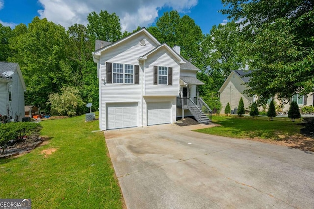 5135 Gable Ridge Way, Sugar Hill, GA 30518 - view of front of property with an attached garage, driveway, a chimney, and a front yard