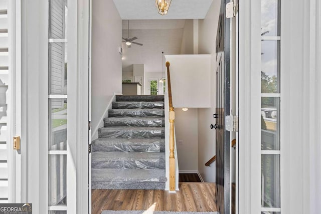 5135 Gable Ridge Way, Sugar Hill, GA 30518 - staircase with a ceiling fan, plenty of natural light, and wood finished floors