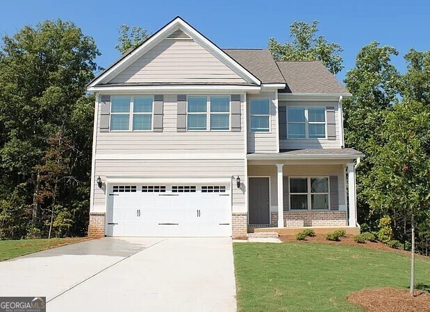 51 Donegal Ct, Dallas, GA 30132 - craftsman house with brick siding, an attached garage, a front yard, and concrete driveway