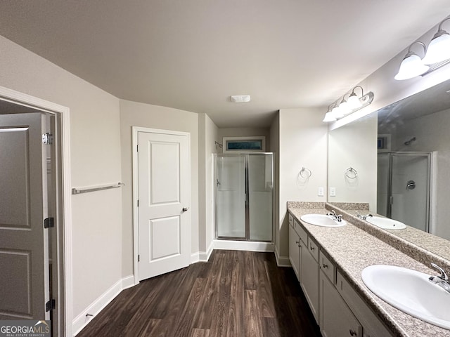 51 Donegal Ct, Dallas, GA 30132 - bathroom with a shower stall, a sink, and wood finished floors