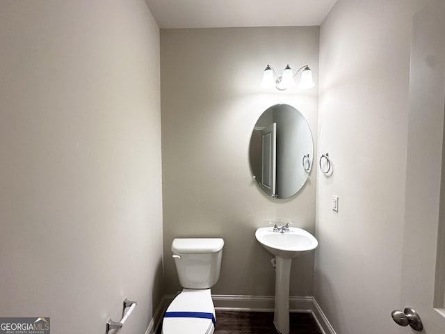51 Donegal Ct, Dallas, GA 30132 - half bathroom with baseboards, toilet, and wood finished floors