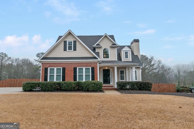 1008 Walnut Creek Dr, Woodstock, GA 30188 - view of front of home with fence, a chimney, a shingled roof, and a front yard