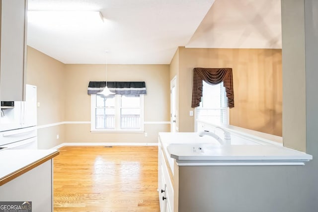 1008 Walnut Creek Dr, Woodstock, GA 30188 - laundry room with light wood-style floors and baseboards