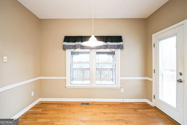 1008 Walnut Creek Dr, Woodstock, GA 30188 - unfurnished dining area with visible vents, a wealth of natural light, and wood finished floors