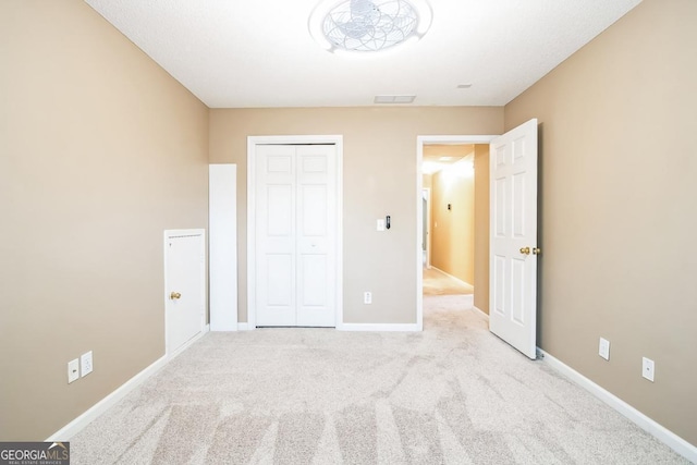 1008 Walnut Creek Dr, Woodstock, GA 30188 - unfurnished bedroom with carpet floors, baseboards, visible vents, and a closet