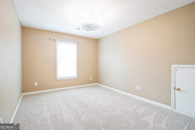 1008 Walnut Creek Dr, Woodstock, GA 30188 - spare room with baseboards, carpet, and a textured ceiling
