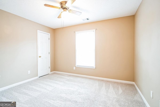 1008 Walnut Creek Dr, Woodstock, GA 30188 - empty room with visible vents, carpet flooring, baseboards, and a ceiling fan
