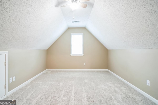 1008 Walnut Creek Dr, Woodstock, GA 30188 - bonus room featuring ceiling fan, a textured ceiling, carpet, baseboards, and visible vents