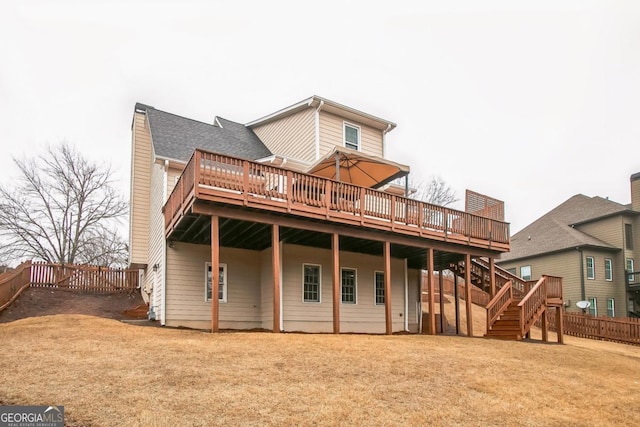 1008 Walnut Creek Dr, Woodstock, GA 30188 - back of property featuring a fenced backyard, a yard, a wooden deck, and stairs